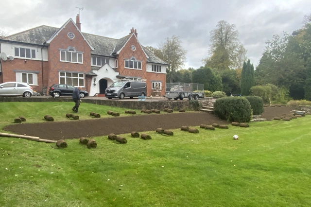 Ground preparation and turf rolls ready for lawn returfing in Leicestershire